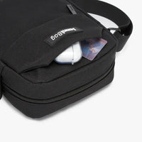 Black travel bag with compartments open, showing organized storage.
