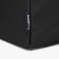 Close-up of a black bag with a label