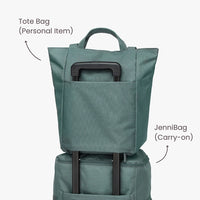 Green tote bag and backpack stacked, with labels indicating use as a personal item and carry-on.
